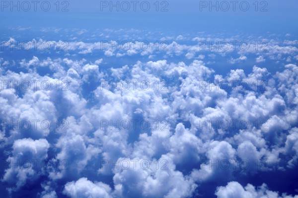 Aerial high view of blue clouds on blue sea