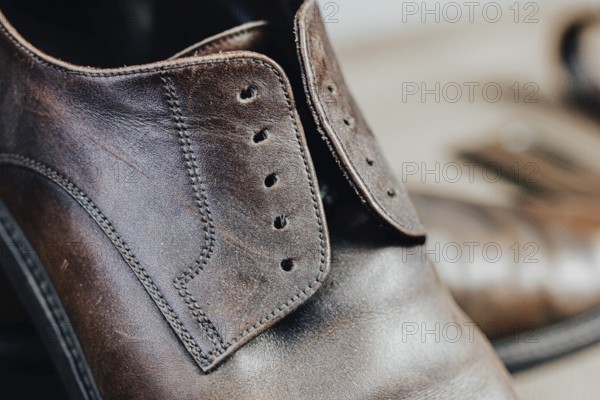 Close-up view of a brown leather shoe showcasing texture and craftsmanship