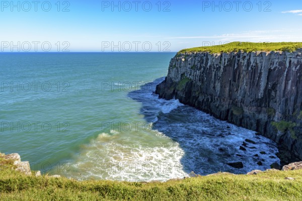 Guarita stone in the city of Torres in Rio Grande do Sul with its cliffs ending in the sea with waves and horizon