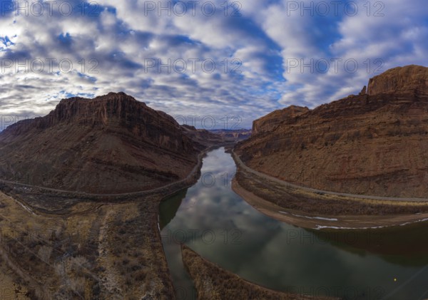 Colorado River and Red Sandstone Mountains on Cloudy Morning. Sky Reflection in Water. Grand County, Utah, USA. Aerial View