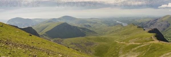 Walking down from Mount Snowdon on the Llanberis Path, Snowdonia, Gwynedd, Wales, UK, looking north towards the Clogwyn station, Llyn Peris and Llanberis