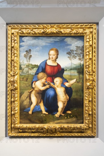 Florence, Italy, June 2022: Madonna and Child with Young St John the Baptist, also named Madonna of the Goldfinch, 1506, by Raffaello Sanzio. Raphael, Renaissance painting masterpiece