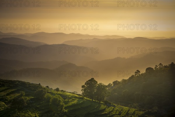 Sunset valley view with terraced fields of Serra de Monchique near mount Foia in the Algarve region in Portugal. Beauty in nature