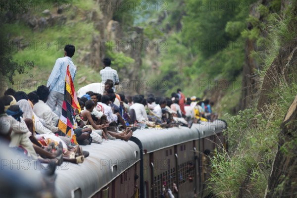 People sitting on train roof, Rajasthan, India