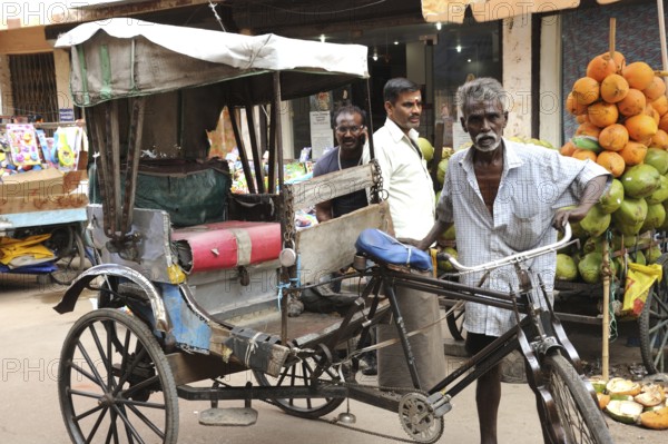 Man with Tricycle rickshaw, Madurai, Tamil Nadu, India