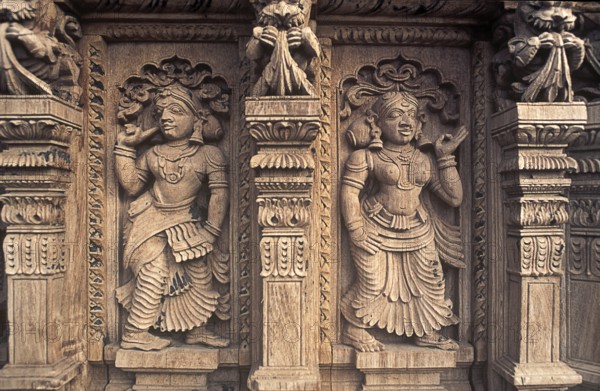 Decorative pieces of women wooden carving statues in old temple chariot at Madurai, Tamil Nadu, India