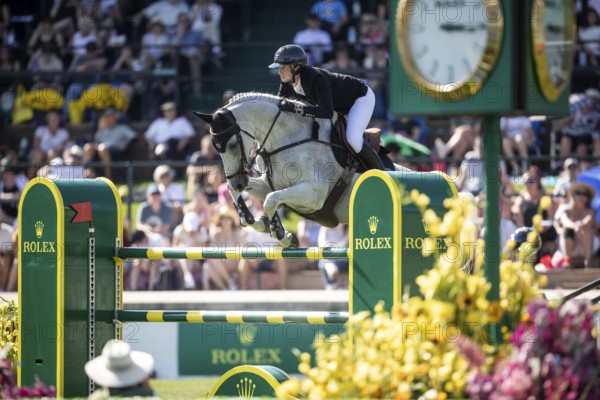 Martin Fuchs of Switzerland and riding Leone Jei compete in the first round of the 1.60m CPKC International during the Spruce Meadows Masters, presented by Rolex, in Calgary, Alberta, Canada, North America