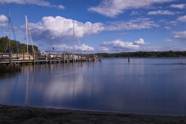 View over the Scharmützelsee with jetty and marina, long exposure, Wendisch-Rietz, Brandenburg, Germany