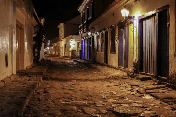 Atmospheric night view of illuminated street and buildings in historical center of Paraty, Brazil, Unesco World Heritage