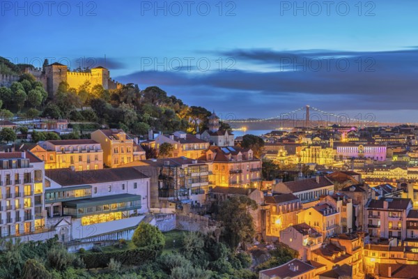 Lisbon Portugal sunset city skyline at Lisbon Baixa district and Saint George Castle