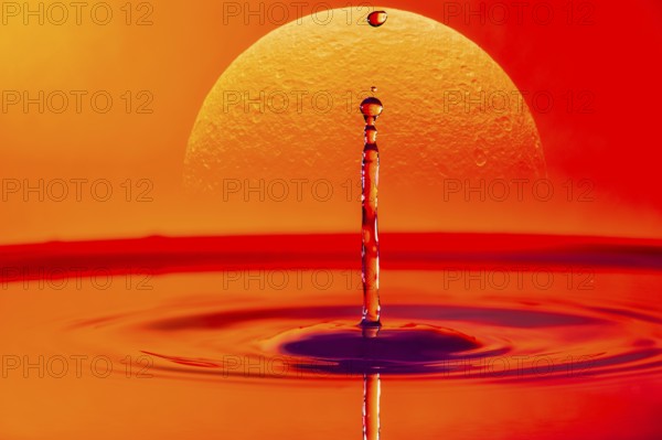 A single drop of water falling into a body of water with a glowing sunset in the background, Saturn, photomontage, high-speed photography