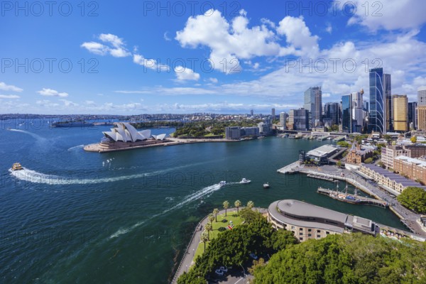SYDNEY, AUSTRALIA, MARCH 4 2023: The Sydney CBD and surrounding harbour, including Circular Quay and The Rocks on a clear autumn day in Sydney, Australia