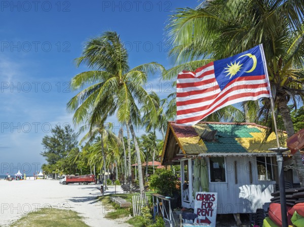 Beach hut with flag, on the sandy beach, Chenang Beach, Langkawi, Kedah State, Malaysia, Southeast Asia