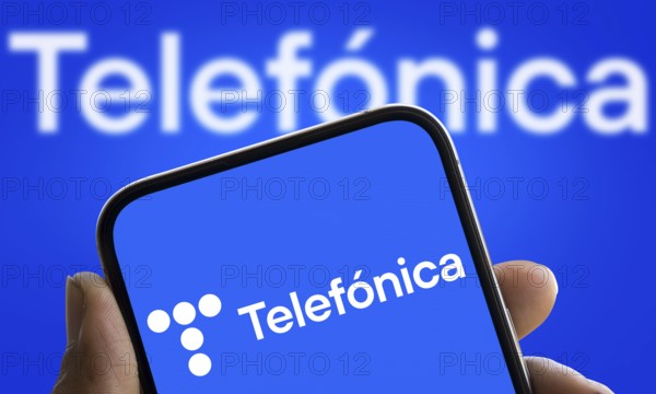 Telefonica logo is displayed on smartphone
