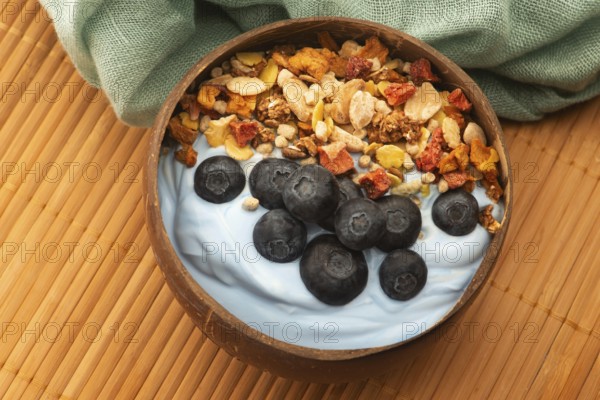 Healthy breakfast concept with flakes, blue spirulina and fresh berries