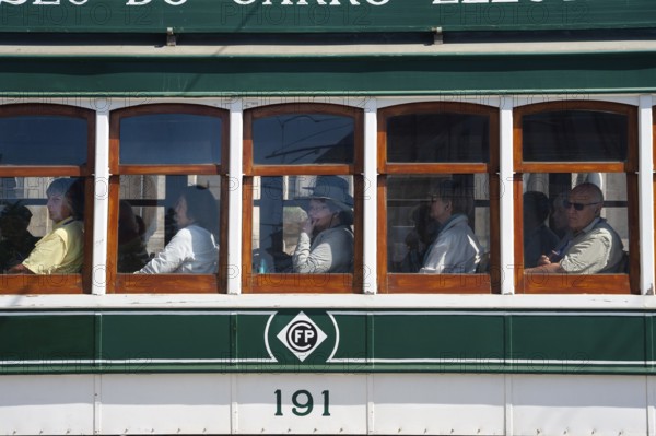 14.06.2018, Porto, Portugal, Europe, Tourists look out of the window during a tram tour through Porto
