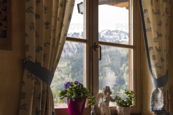 Decorative window with a view of the Tannheimer Tal, Tyrol, Austria, spring