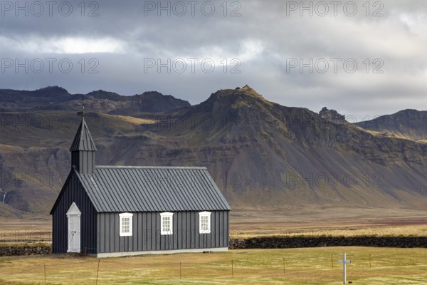Black wooden church in Budor, Iceland