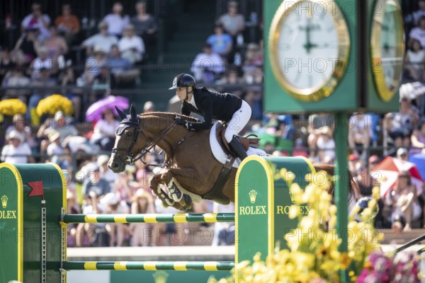 Jana Wargers of Germany and riding Dorette Old compete in the first round of the 1.60m CPKC International during the Spruce Meadows Masters, presented by Rolex, in Calgary, Alberta, Canada, North America