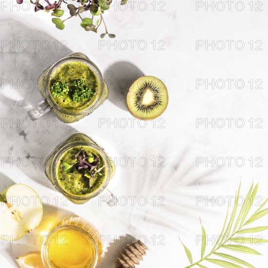 Food, Green detox cocktails in two cans, standing on a white table, top view, healthy lifestyle concept, copy space