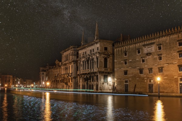 View on Canal Grande at Night, Boats passing by, Venice, Italy