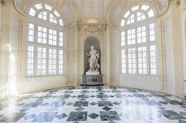 Venaria Reale, Italy, January 2023: luxury interior old royal palace. Gallery perspective with window