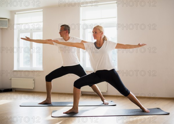 Adult male woman exercising together