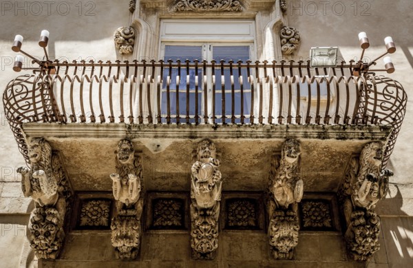 Noto town in Sicily, the Baroque Wonder - UNESCO Heritage Site. Detail of Palazzo Nicolaci balcony, the maximum expression of the Sicilian Baroque style
