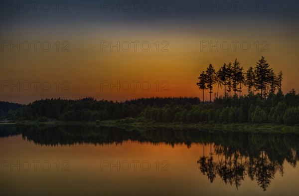 Sunset at the lake in the Harz Mountains