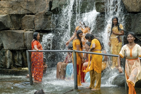 Tourists enjoying the Kodiveri waterfalls near Sathyamangalam, Tamil Nadu, South India, India, Asia