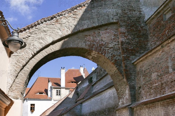 View through the gate of the old buildings in the Romanian city of Sibiu