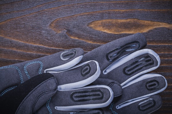 Working safety gloves on wood board gardening concept