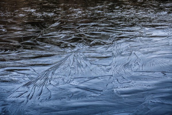 Frozen lake, structures of the water surface