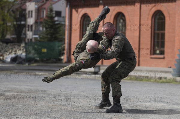 LEGNICA, POLAND, APRIL 26, 2023: Military picnic as part of the Cyber Mil Academy program. Hand to hand martial arts show of soldiers