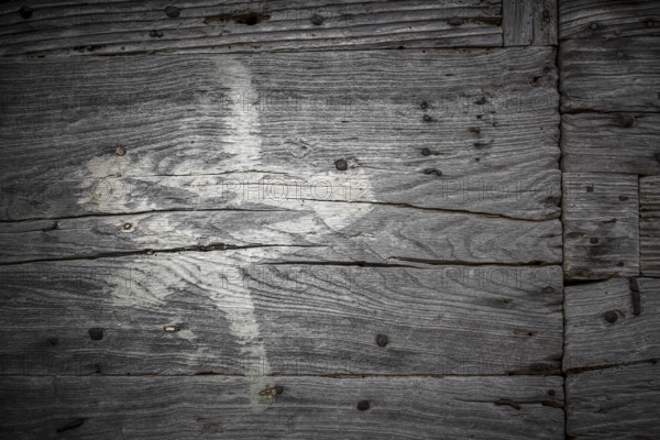 White star painted on the old cracked wood with worn-out paint. Grunge look