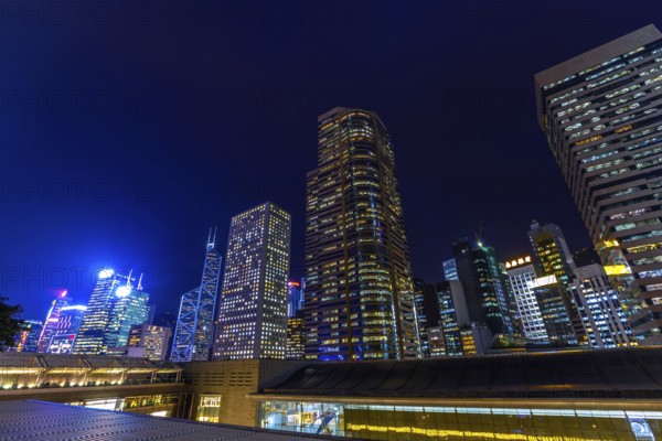 Aerial view of Hong Kong skyscrapers in Central District at night in Hong Kong island