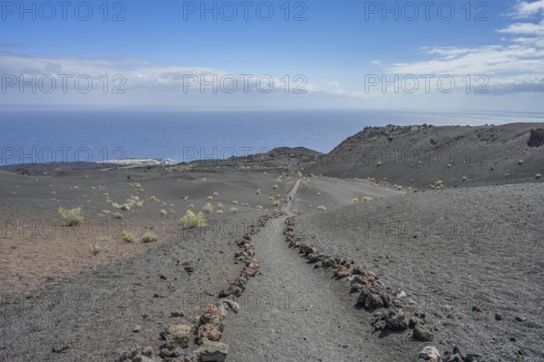 Hiking trail in the lava field at Volcan de Teneguia, Fuencaliente, La Palma, Spain