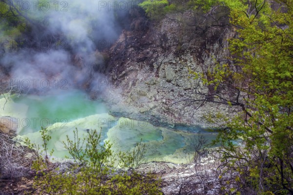 Wai-O-Tapu Geyser Park. Volcanic Valley Waimangu. Inferno Crater Lake is a large hot spring and bright green water. New Zealand, North Island. The concept of exotic, ecological and photo tourism