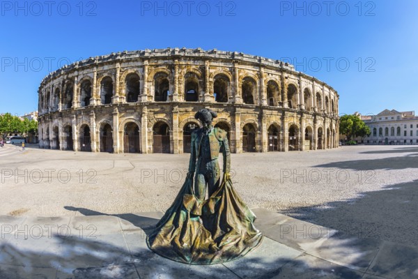 The Roman amphitheater in Nymes, Provence. The monument to toreador is placed into square. The picture is made a lens Fisheye