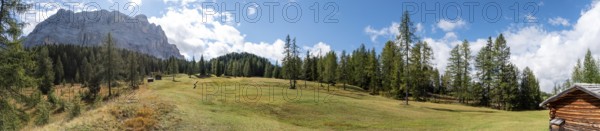 Typical alp with a hay shed in the Dolomite Alps in the Fanes Sennes Prags Nature Park, South Tirol in Italy