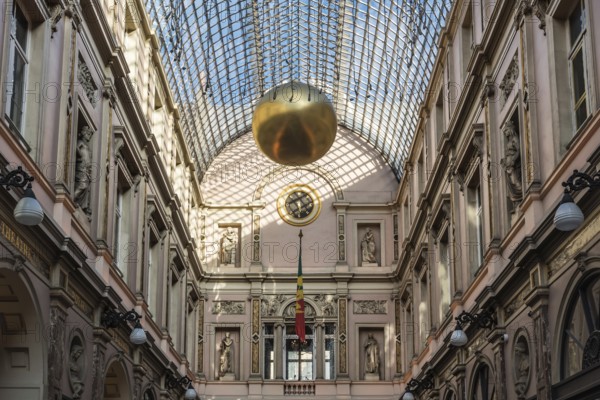 Brussels, Belgium, 12 18 2018: Glass roof and facades of the Saint Hubertus Gallery in Art Nouveau style with Christmas decoration