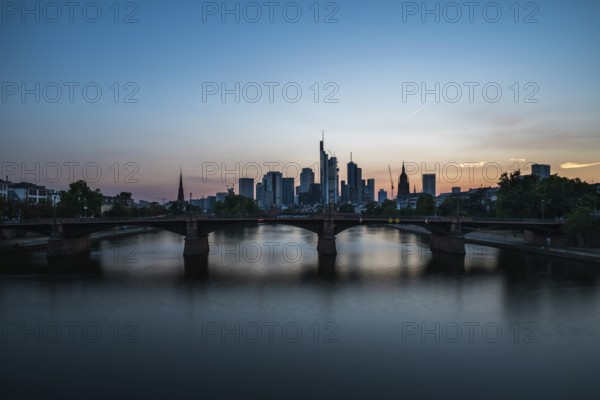 Frankfurt am Main, Hesse, Germany, 07 23 2018: cityscape at night taken from the river Main at the Flosserbrucke