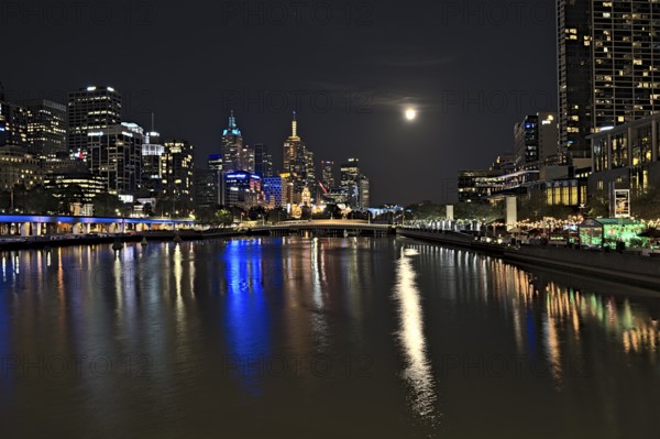 The skyline of Melbourne and the Yarra river at nighttime when there was an event of supermoon