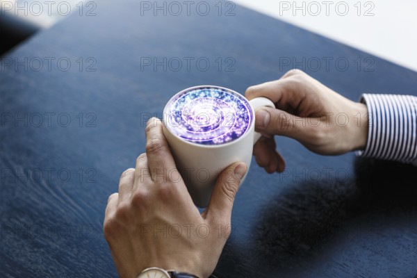 Coffee cup with cosmos space on wooden table
