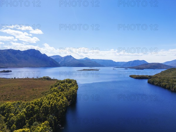 Lake Burbury and surrounding mountain landscape on a warm summer's aftenoon near Queenstown in Tasmania, Australia