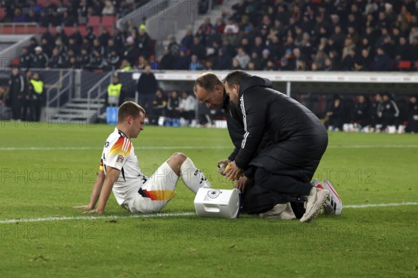 Joshua Kimmich (FC Bayern Munich) has to be treated and substituted after a blow to the foot during the UEFA Nations League match: Germany v Bosnia-Herzegovina, Freiburg, Germany / Germany