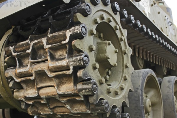 Part of the undercarriage of tracked military equipment, close-up