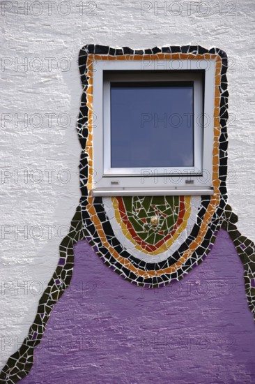 The close-up of a window which was decorated all around with glass splinters