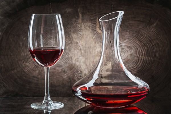 Wineglasss And Decanter With Red Wine On Vintage Wood Background