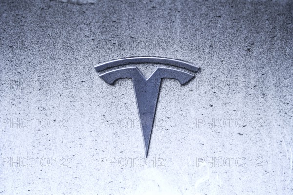 Tesla logo on an electric car